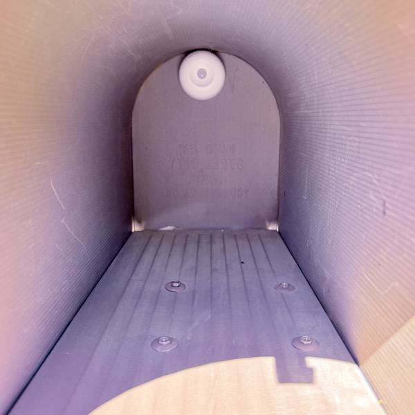 YoLink motion sensor stuck on inside back wall of mailbox, near the top